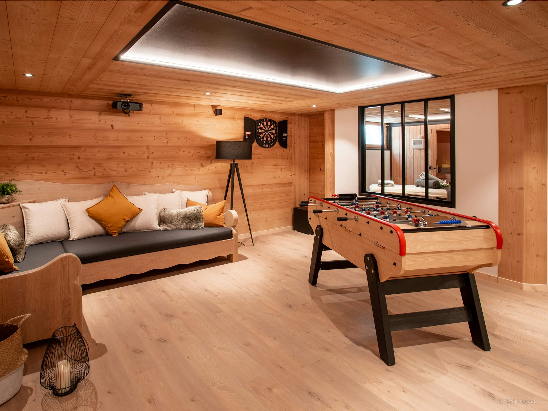chalet-julena-games-space-with-uplighting-and-foosball